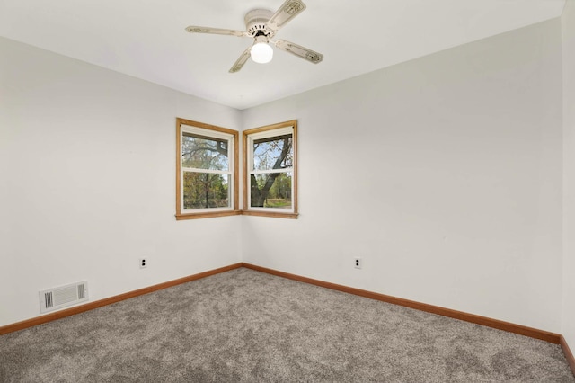 unfurnished room with carpet, baseboards, and ceiling fan