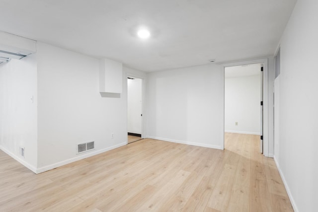 6715 Bloomington Ave, Richfield, MN 55423 - finished basement featuring baseboards, visible vents, and light wood-style flooring