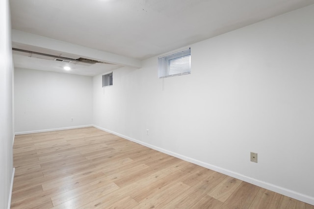 6715 Bloomington Ave, Richfield, MN 55423 - below grade area featuring light wood-style floors, baseboards, and visible vents