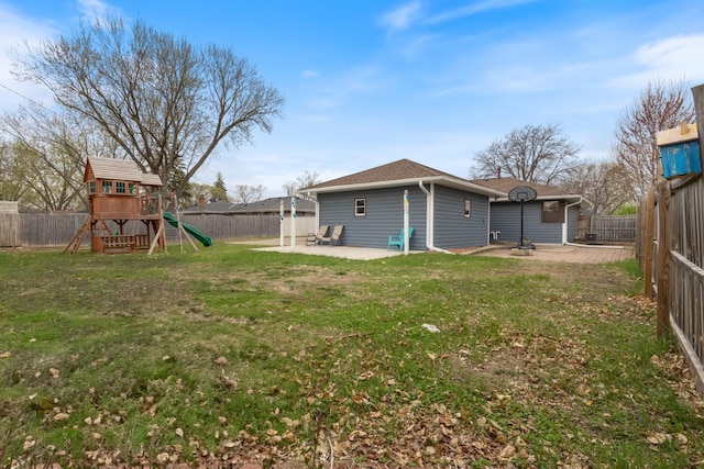 6715 Bloomington Ave, Richfield, MN 55423 - rear view of property featuring a patio, a fenced backyard, a playground, and a yard