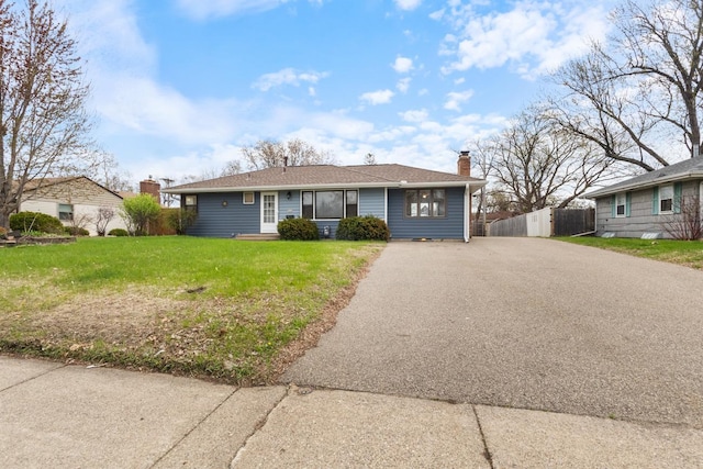6715 Bloomington Ave, Richfield, MN 55423 - view of front of house with driveway and a chimney