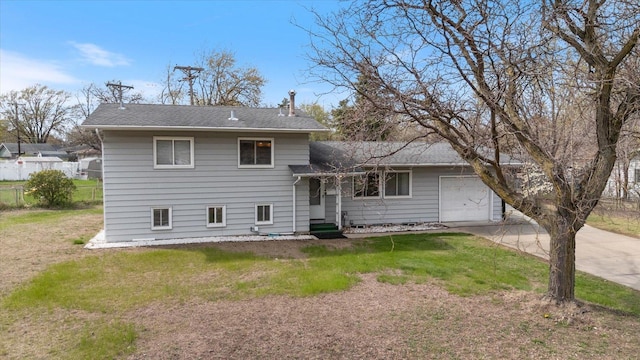 view of front of property with a garage, a front lawn, a shingled roof, and concrete driveway
