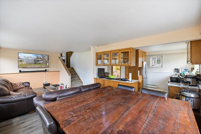 interior space featuring light wood-style floors and a baseboard radiator