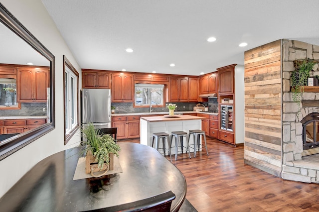 kitchen featuring a kitchen island, stainless steel appliances, recessed lighting, and tasteful backsplash