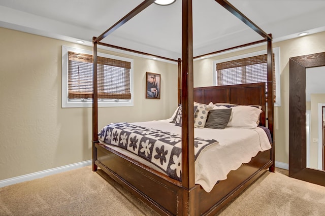 carpeted bedroom with baseboards