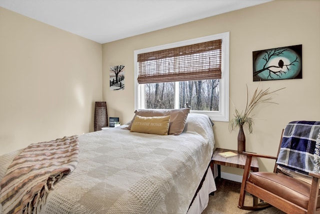 carpeted bedroom with baseboards