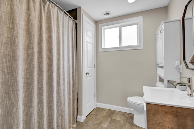 full bath with visible vents, baseboards, tile patterned floors, vanity, and toilet