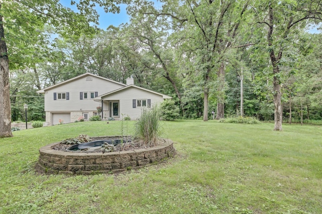 73466 318th Ave, Lake City, MN 55041 - view of green lawn featuring an attached garage