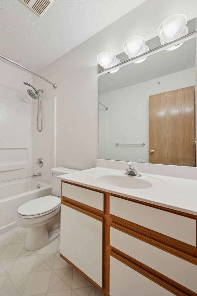 9110 Terra Verde Trl, Eden Prairie, MN 55347 - bathroom with bathing tub / shower combination, vanity, toilet, and a textured ceiling