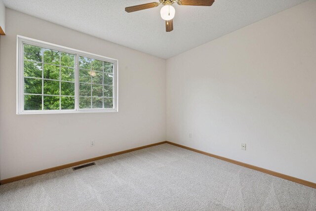 9110 Terra Verde Trl, Eden Prairie, MN 55347 - unfurnished room featuring light carpet, baseboards, and ceiling fan