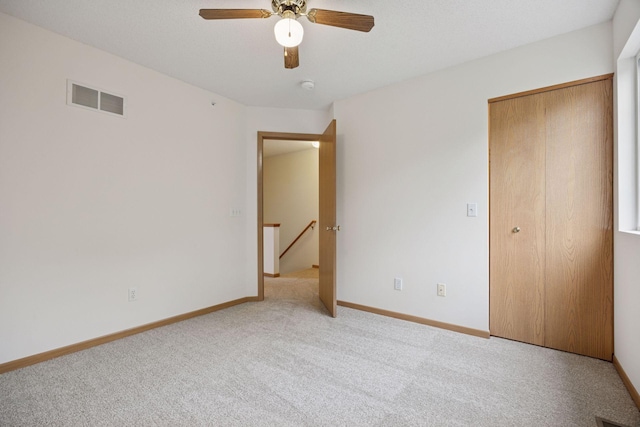 9110 Terra Verde Trl, Eden Prairie, MN 55347 - unfurnished bedroom featuring light colored carpet, a closet, baseboards, and ceiling fan