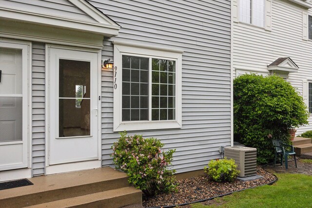 9110 Terra Verde Trl, Eden Prairie, MN 55347 - doorway to property featuring central AC unit
