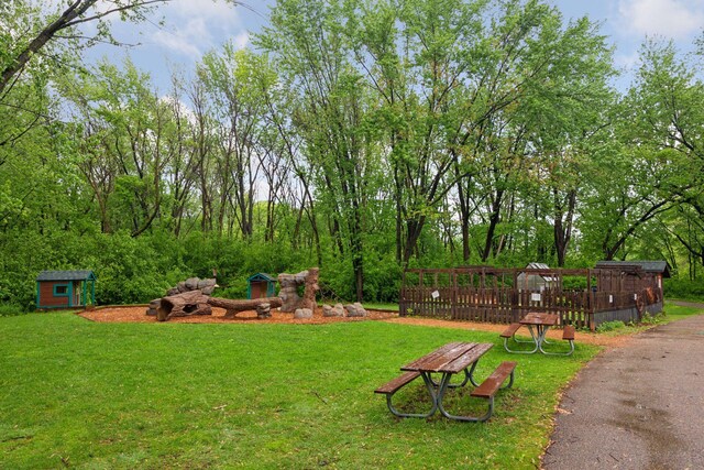 9110 Terra Verde Trl, Eden Prairie, MN 55347 - view of grassy yard with an outbuilding