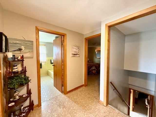 15497 Meiners Rd, Mayville Twp, MN 55921 - corridor with an upstairs landing and baseboards