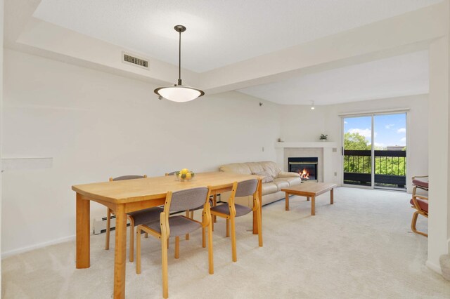 7540 Edinborough Way Unit 1319, Edina, MN 55435 - dining area featuring light colored carpet, a glass covered fireplace, and baseboards