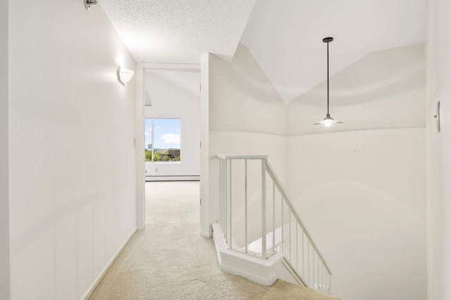 7540 Edinborough Way Unit 1319, Edina, MN 55435 - corridor with an upstairs landing, a baseboard heating unit, light colored carpet, lofted ceiling, and baseboards