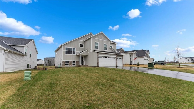 traditional home with a garage, board and batten siding, a front yard, and concrete driveway