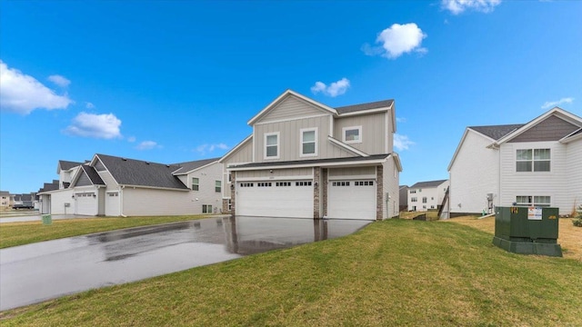 view of front of property featuring a garage, board and batten siding, concrete driveway, and a front lawn