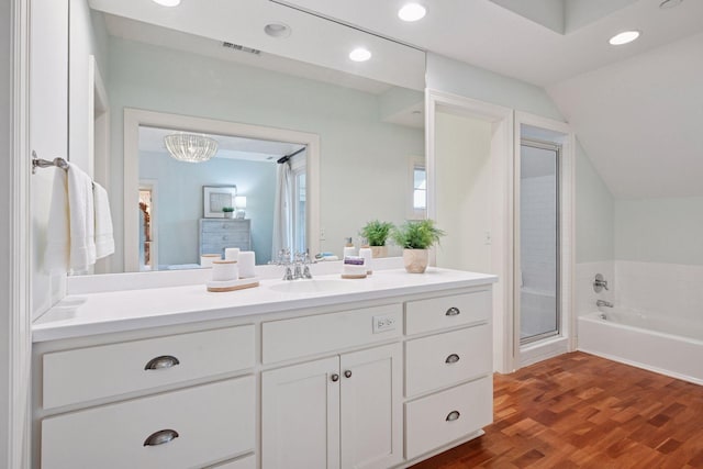 205 Mill St Unit S301, Excelsior, MN 55331 - full bath with vanity, vaulted ceiling, a garden tub, recessed lighting, and wood finished floors