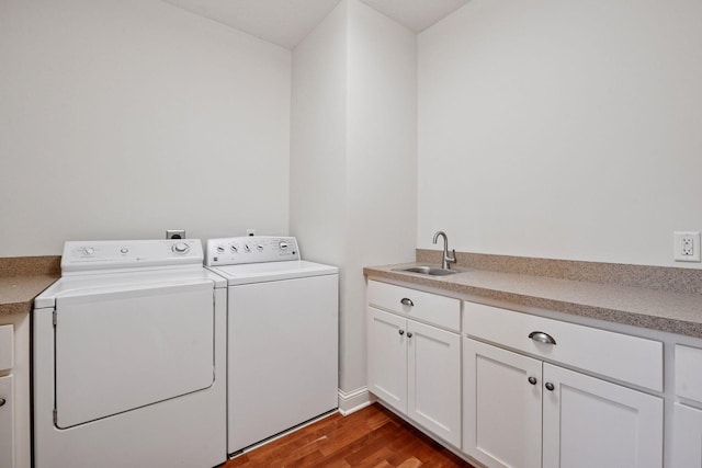 205 Mill St Unit S301, Excelsior, MN 55331 - washroom with washer and dryer, wood finished floors, and cabinet space