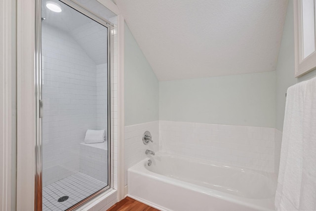 205 Mill St Unit S301, Excelsior, MN 55331 - full bathroom with vaulted ceiling, a garden tub, a stall shower, and wood finished floors