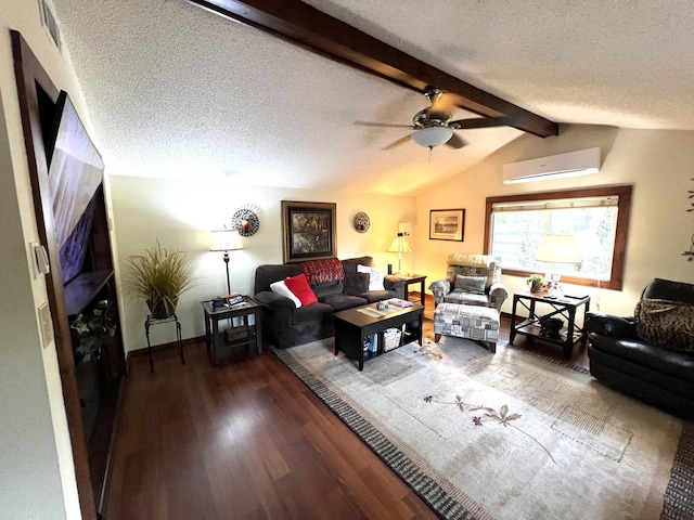 living area with wood finished floors, a wall mounted air conditioner, a textured ceiling, a ceiling fan, and baseboards
