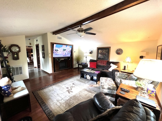 living room featuring wood finished floors, a textured ceiling, and a ceiling fan