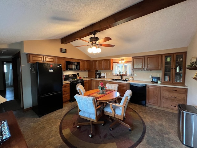 kitchen featuring black appliances, light countertops, brown cabinets, a textured ceiling, and a sink