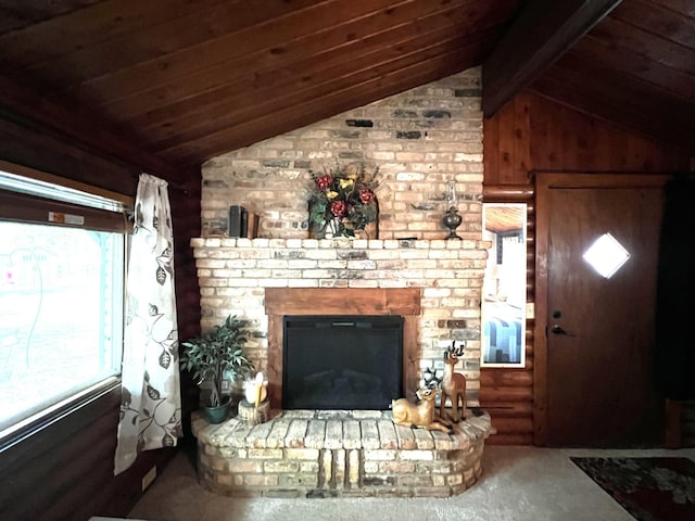 unfurnished living room with a fireplace, wooden ceiling, and carpet floors