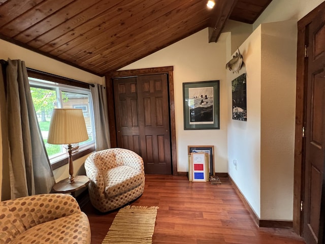 sitting room with wood finished floors, baseboards, and wooden ceiling
