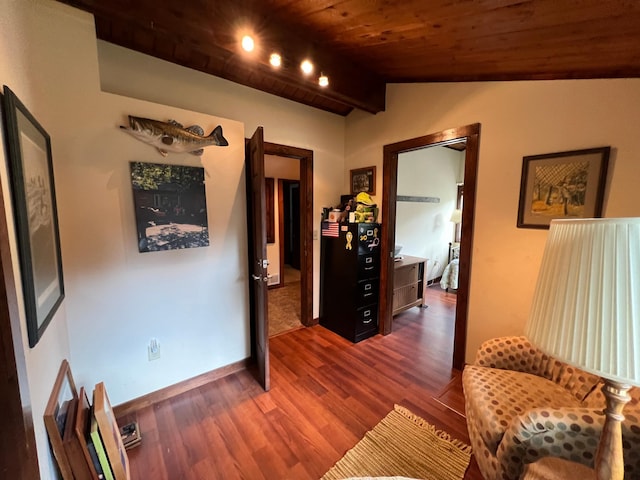 sitting room with dark wood-style flooring, wooden ceiling, lofted ceiling, and baseboards