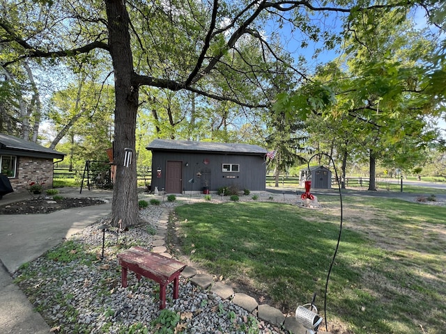 view of yard with a storage unit and an outdoor structure