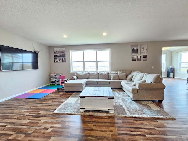 2505 Jaber Ave NE, Saint Michael, MN 55376 - living area with wood finished floors, recessed lighting, baseboards, and a textured ceiling
