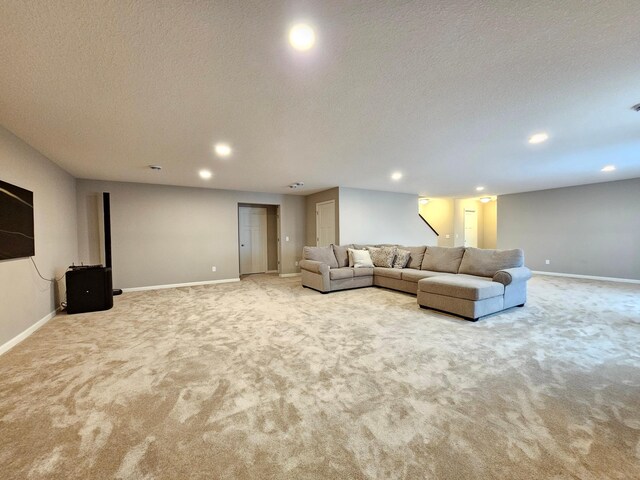 2505 Jaber Ave NE, Saint Michael, MN 55376 - carpeted living area featuring baseboards, recessed lighting, a textured ceiling, and stairs