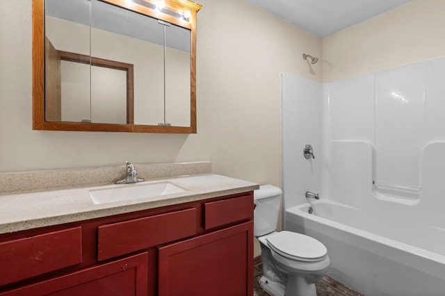 bathroom featuring toilet, shower / washtub combination, and vanity