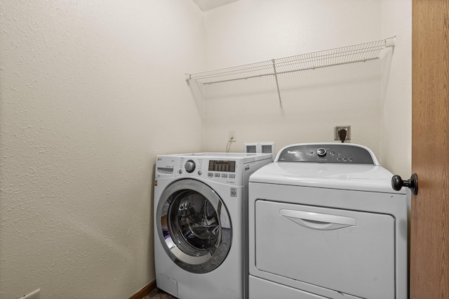 laundry area featuring washer and dryer and laundry area