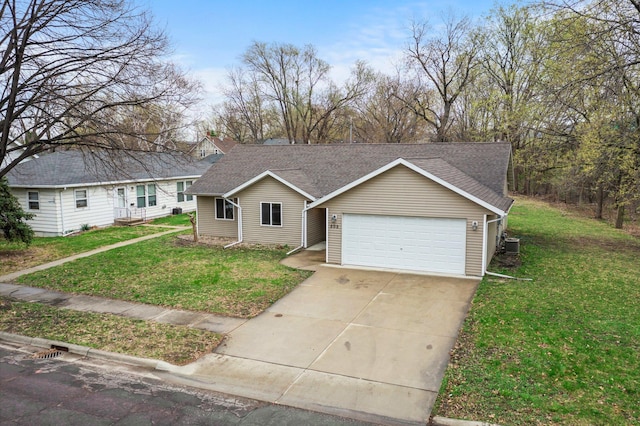ranch-style house featuring a front yard, driveway, a shingled roof, and an attached garage