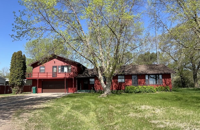 10151 US Highway 169, Garrison, MN 56450 - view of front of house featuring dirt driveway, a garage, and a front lawn