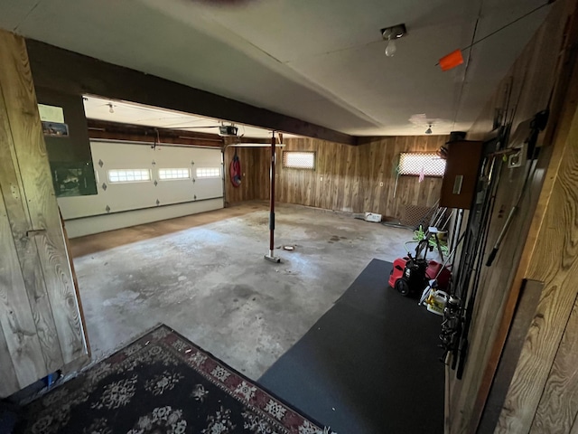 10151 US Highway 169, Garrison, MN 56450 - garage featuring a garage door opener and wooden walls