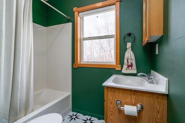 bathroom featuring a healthy amount of sunlight, vanity, and shower / tub combo with curtain