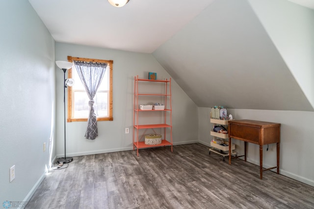 home office with lofted ceiling, wood finished floors, and baseboards