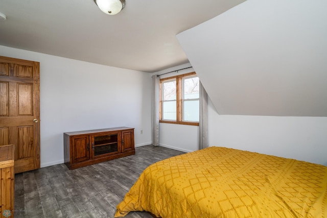 bedroom featuring dark wood-style flooring and baseboards