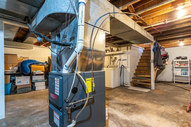 unfinished below grade area featuring concrete block wall and stairway