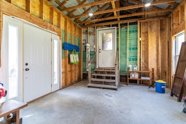 interior space with a wealth of natural light and unfinished concrete flooring