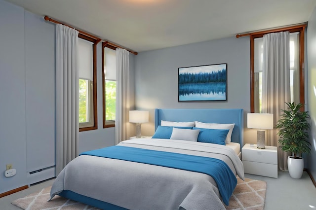 carpeted bedroom featuring a baseboard heating unit