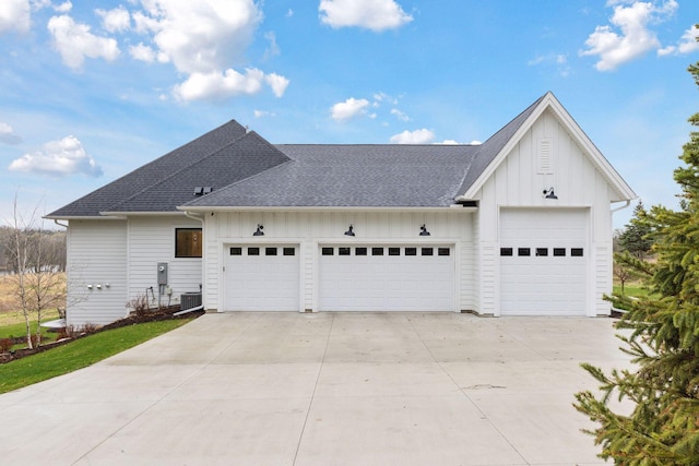view of front of property with cooling unit, board and batten siding, a garage, and a shingled roof