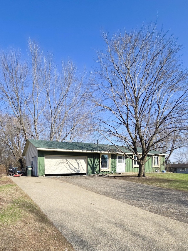 single story home featuring an attached garage