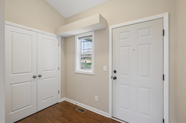 entrance foyer featuring baseboards, dark wood-type flooring, and visible vents