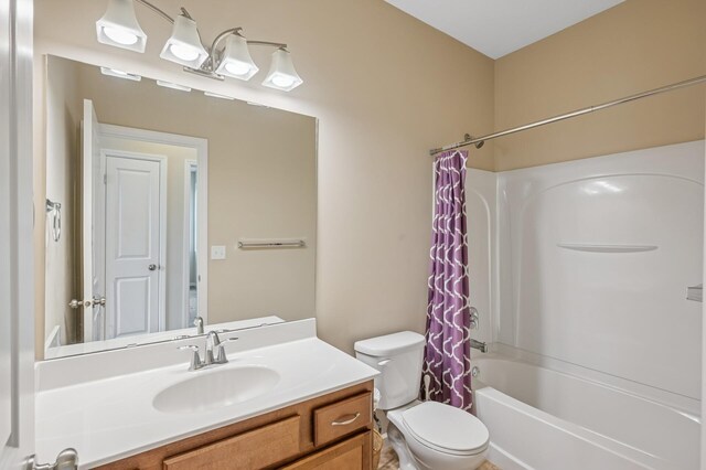 bathroom with shower / bath combo with shower curtain, toilet, and vanity