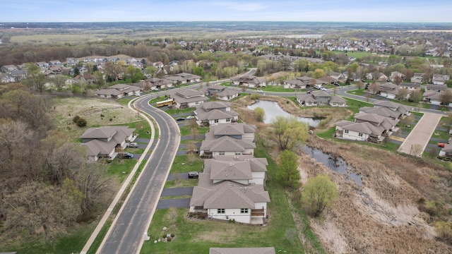 aerial view with a water view and a residential view